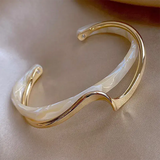 Elegantly opened bangle with white and zlatý enamel