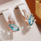 Elegantné náušnice with turquoise crystals in zlatý