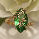 Green golden gemstone and a dragonfly